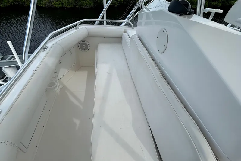 Slide: The Image of 2008 Cabo Yachts Sportfish 35 interior with white seating and sleek design. - 5