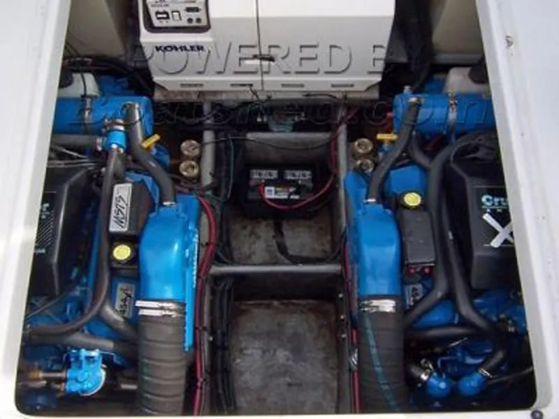 Slide: The Image of Engine compartment of 1993 Mainship 36 Express with dual blue engines and Kohler generator. - 21