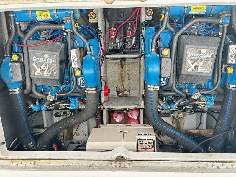 Slide: The Image of Engine compartment of a 1993 Mainship 36 Express with dual Crusader XL engines. - 22