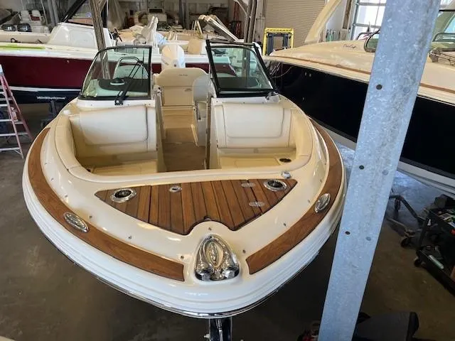 Slide: The Image of 2022 Chris-Craft Calypso 24 boat in a storage facility. - 3