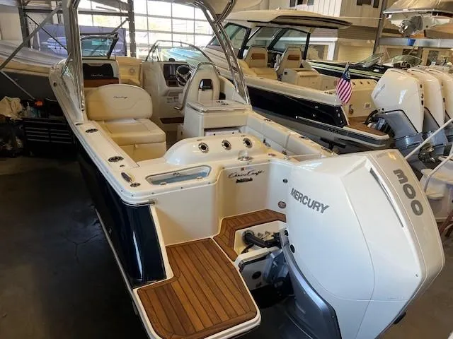 Slide: The Image of 2022 Chris-Craft Calypso 24 boat with Mercury 300 outboard engine in showroom. - 7