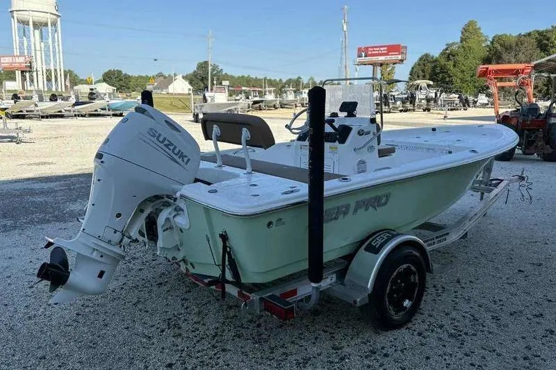 Slide: The Image of 2024 Sea Pro 172 Bay boat with Suzuki outboard motor on trailer. - 15