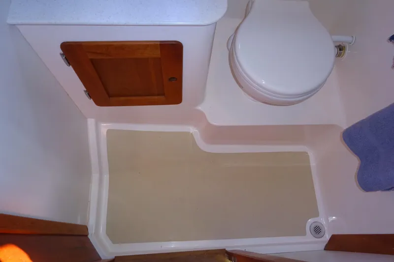Slide: The Image of Bathroom interior of 2007 Hunt Yachts Surfhunter 29 with toilet and wooden cabinet. - 53