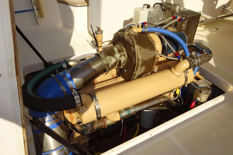 Slide: The Image of Engine compartment of 2007 Hunt Yachts Surfhunter 29, showcasing detailed mechanical components. - 56