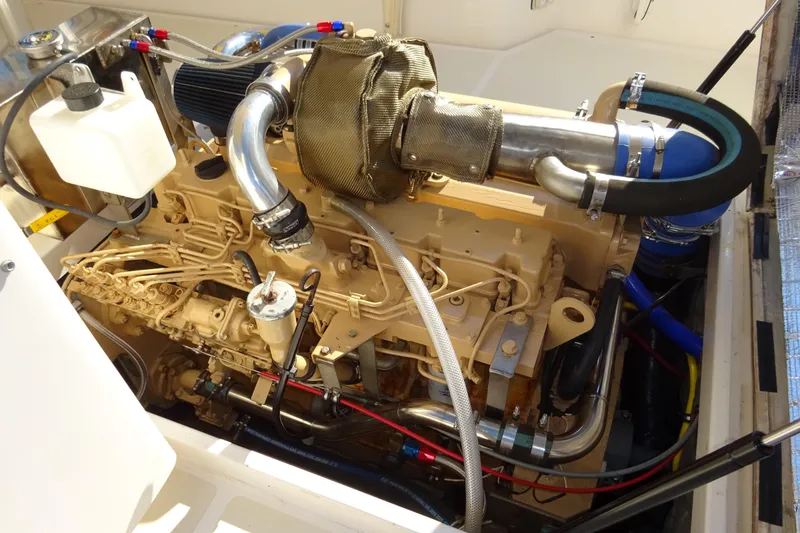 Slide: The Image of Engine compartment of 2007 Hunt Yachts Surfhunter 29, showcasing detailed mechanical components. - 57