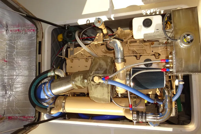 Slide: The Image of Engine compartment of 2007 Hunt Yachts Surfhunter 29, showcasing detailed mechanical components. - 60