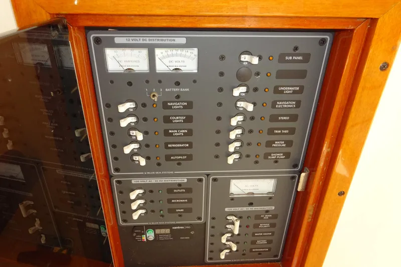 Slide: The Image of Electrical panel of 2007 Hunt Yachts Surfhunter 29, featuring various switches and meters. - 62