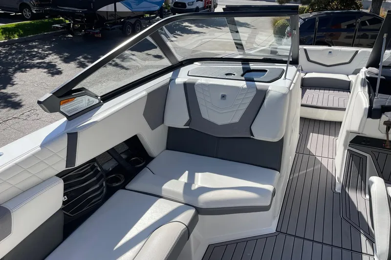 Slide: The Image of 2023 Nautique Super Air Nautique G25 interior with sleek seating and modern design. - 10