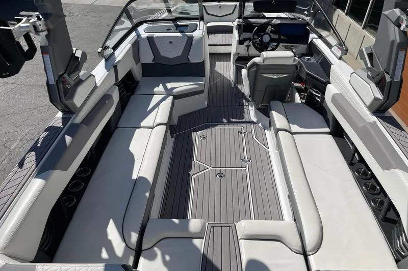 Slide: The Image of 2023 Nautique Super Air Nautique G25 interior with spacious seating and modern design. - 5