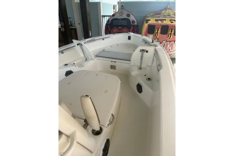 Slide: The Image of 2024 Boston Whaler 250 Dauntless boat interior with seating and storage compartments. - 4