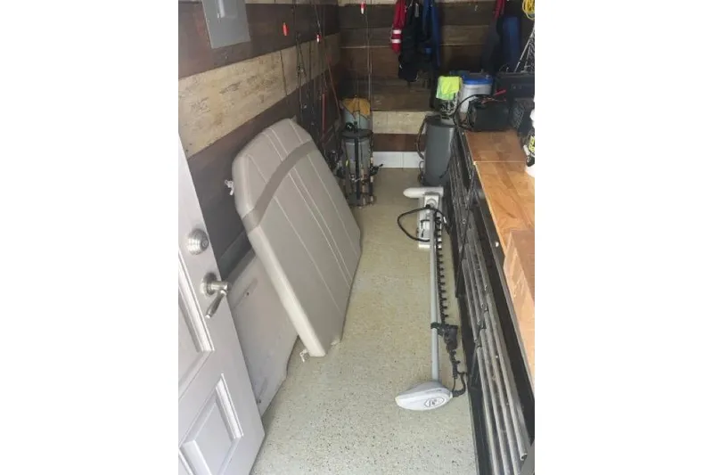 Slide: The Image of Storage area with fishing gear and equipment for 2024 Boston Whaler 250 Dauntless. - 6