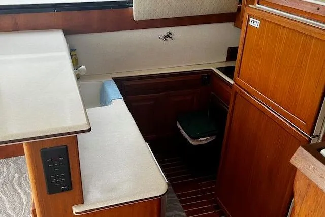 Slide: The Image of 1988 Viking 45 Convertible yacht interior with wood cabinetry and countertops. - 12