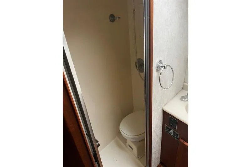 Slide: The Image of 1988 Viking 45 Convertible yacht bathroom with shower and toilet. - 18