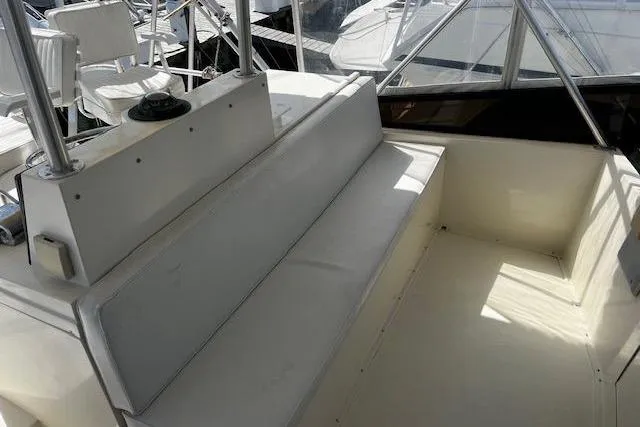 Slide: The Image of 1988 Viking 45 Convertible boat interior with white seating, great deal available. - 33