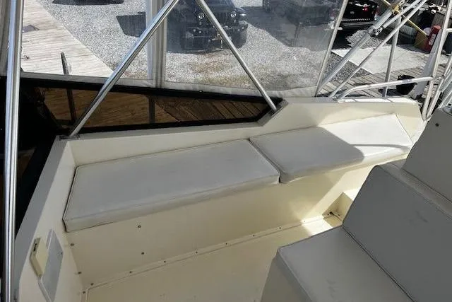 Slide: The Image of 1988 Viking 45 Convertible boat interior with cushioned seating and metal framework. - 34
