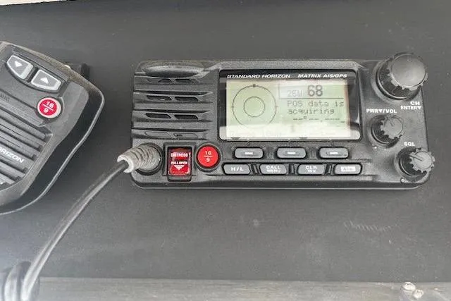 Slide: The Image of Marine radio equipment on 1988 Viking 45 Convertible boat dashboard. - 39