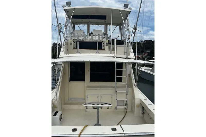 Slide: The Image of 1988 Viking 45 Convertible boat with flybridge, ladder, and spacious deck. - 4