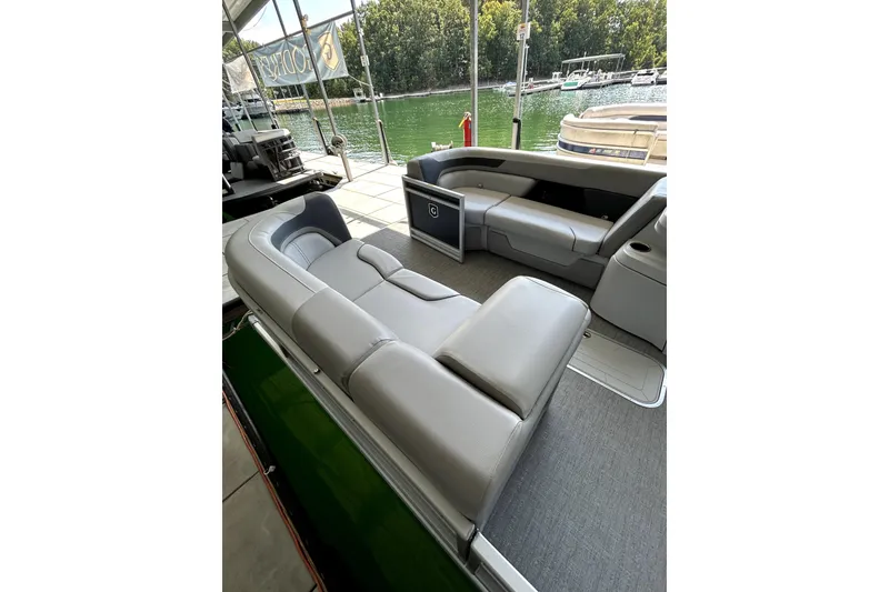 Slide: The Image of 2025 Godfrey SWEETWATER 2286 SFL pontoon boat interior with luxurious seating and lake view. - 11