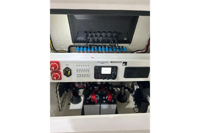 Slide: The Image of 2024 Contender 26 Bay boat electrical panel with Garmin system and battery setup. - 6