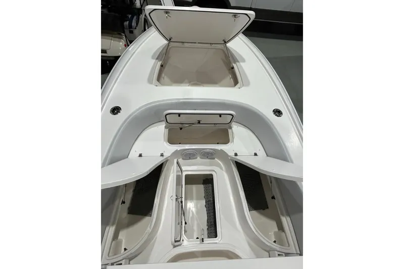 Slide: The Image of 2024 Contender 26 Bay boat interior with open storage compartments. - 9