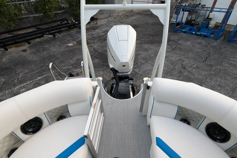Slide: The Image of 2026 Trifecta 25 RF SS Arch boat with Mercury engine, white seating, and modern design. - 17