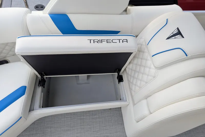Slide: The Image of 2026 Trifecta 25 RF SS Arch boat seat with storage compartment, white and blue design. - 19