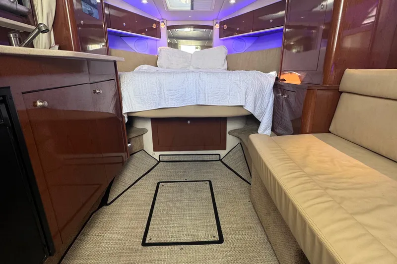 Slide: The Image of Interior of 2008 Sea Ray 350 Sundancer yacht with cozy bed and seating area. - 33