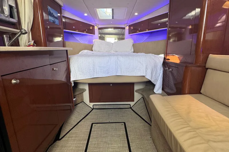 Slide: The Image of Luxurious interior of 2008 Sea Ray 350 Sundancer yacht with cozy bed and ambient lighting. - 34