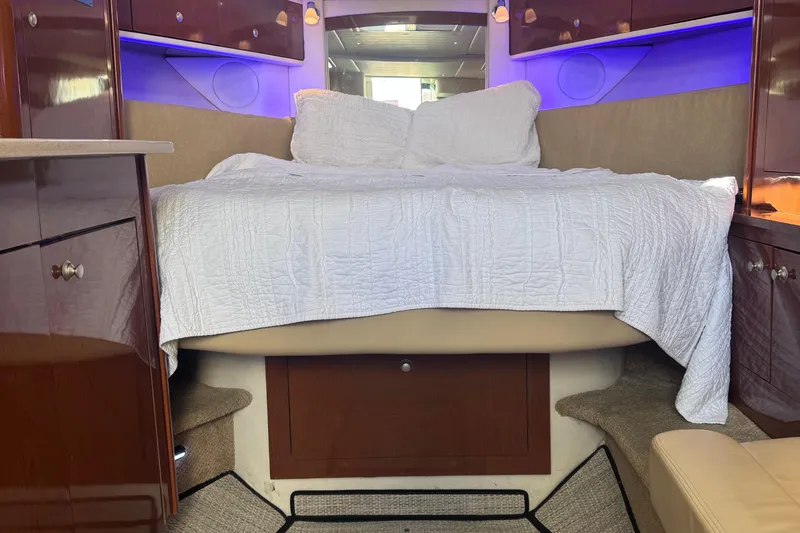 Slide: The Image of Luxurious cabin interior of 2008 Sea Ray 350 Sundancer with cozy bed and ambient lighting. - 36