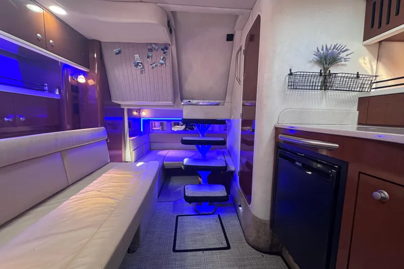 Slide: The Image of Interior of 2008 Sea Ray 350 Sundancer yacht with modern lighting and cozy seating. - 38