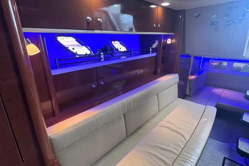 Slide: The Image of Luxurious interior of 2008 Sea Ray 350 Sundancer yacht with blue ambient lighting. - 40