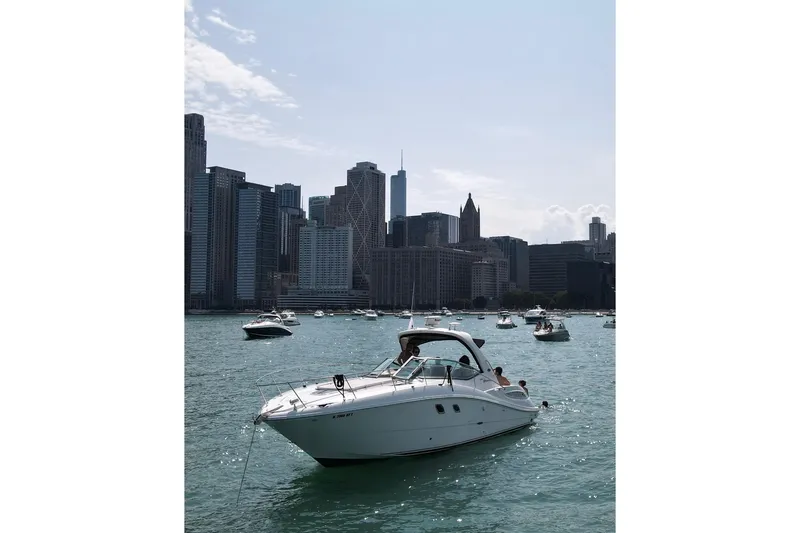 Slide: The Image of Sea Ray 350 Sundancer 2008 yacht on water with city skyline background. - 53