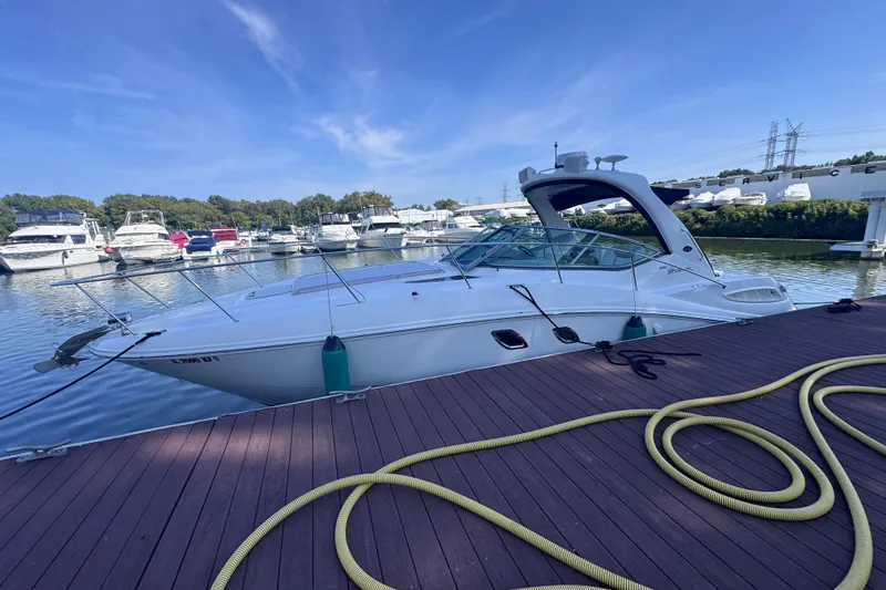 Slide: The Image of 2008 Sea Ray 350 Sundancer docked at marina, surrounded by other boats. - 60
