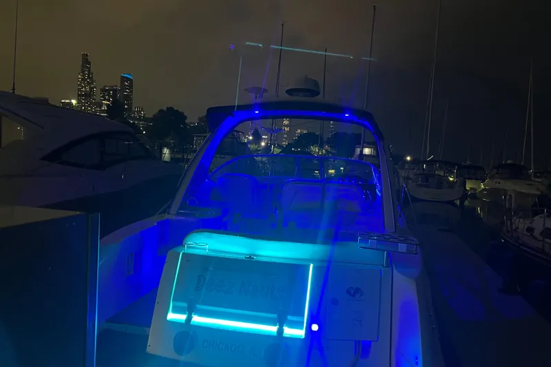 Slide: The Image of 2008 Sea Ray 350 Sundancer yacht illuminated at night in Chicago marina. - 62