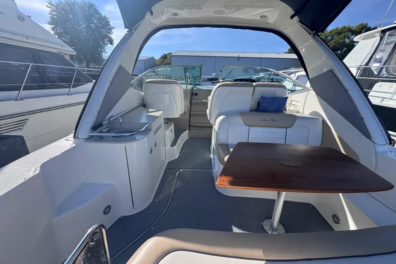 Slide: The Image of Interior view of a 2008 Sea Ray 350 Sundancer yacht with seating and table. - 9