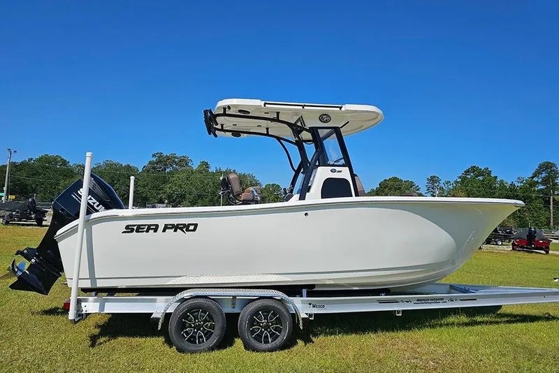 The Image of 2026 Sea Pro 242 Center Console Sport boat on trailer, displayed outdoors. - 1