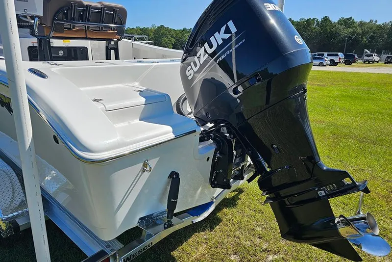 Slide: The Image of 2026 Sea Pro 242 Center Console Sport boat with Suzuki outboard motor on trailer. - 10