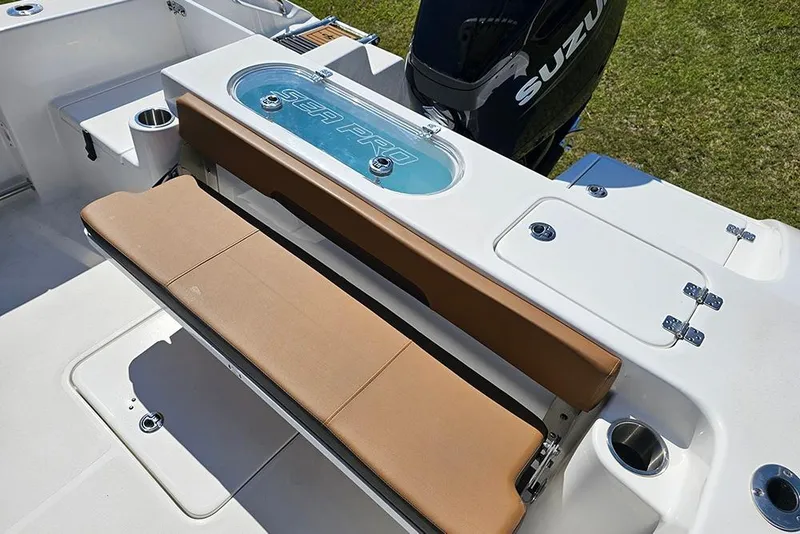 Slide: The Image of 2026 Sea Pro 242 Center Console Sport boat with tan seating and Suzuki engine. - 12