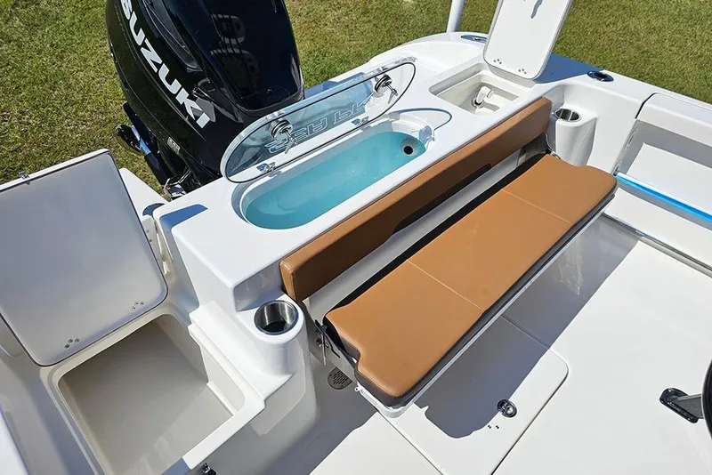 Slide: The Image of 2026 Sea Pro 242 Center Console Sport boat interior with seating and storage compartments. - 13
