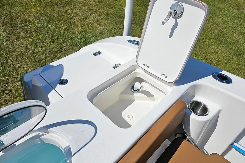 Slide: The Image of 2026 Sea Pro 242 Center Console Sport boat with open storage compartment on deck. - 15