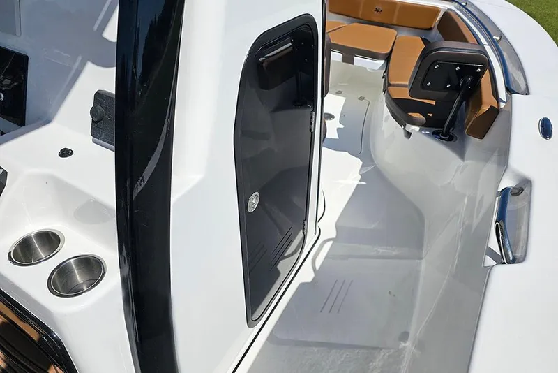 Slide: The Image of 2026 Sea Pro 242 Center Console Sport interior with seating and cup holders. - 26