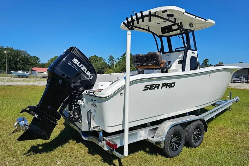 Slide: The Image of 2026 Sea Pro 242 Center Console Sport boat on trailer with Suzuki outboard motor. - 3