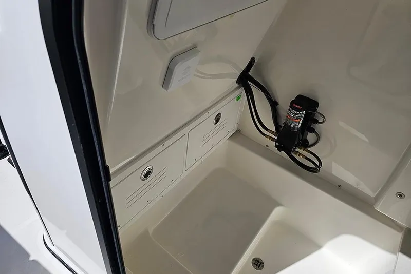 Slide: The Image of Interior view of 2026 Sea Pro 242 Center Console Sport boat compartment. - 30