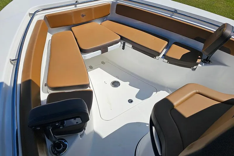 Slide: The Image of 2026 Sea Pro 242 Center Console Sport boat interior with tan seating and spacious layout. - 33