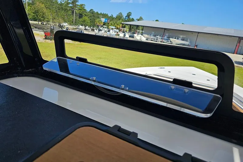 Slide: The Image of 2026 Sea Pro 242 Center Console Sport boat windshield view, showcasing outdoor marina setting. - 39
