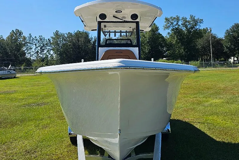 Slide: The Image of 2026 Sea Pro 242 Center Console Sport boat on grassy field, front view. - 5