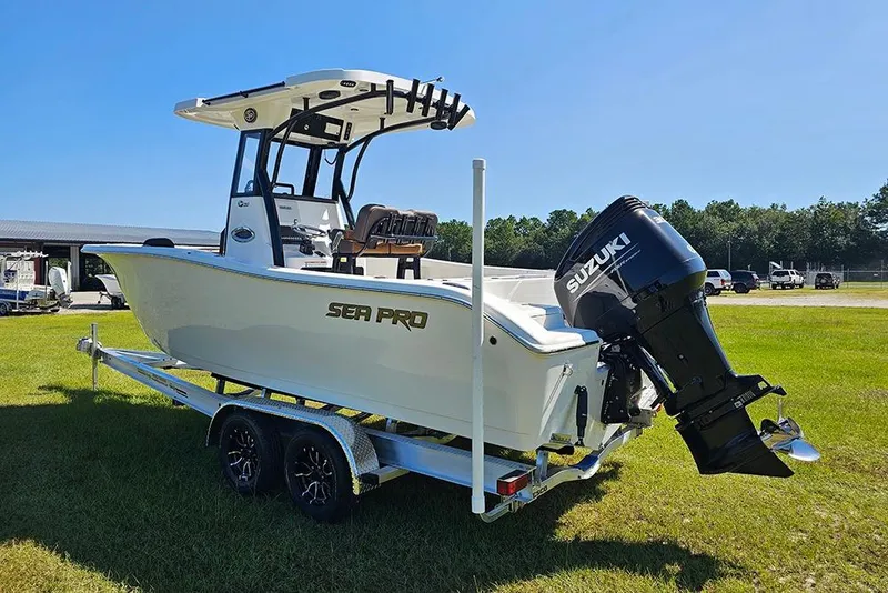 Slide: The Image of 2026 Sea Pro 242 Center Console Sport boat on trailer with Suzuki outboard motor. - 8