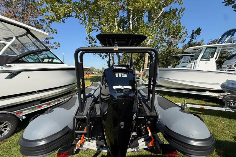 Slide: The Image of 2025 Highfield Patrol 540 boat with Mercury engine displayed outdoors. - 3