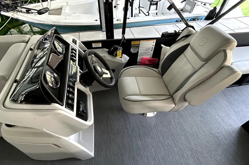 Slide: The Image of Interior of 2026 Godfrey Sweetwater 2486 SFLC boat with modern helm and captain's chair. - 14