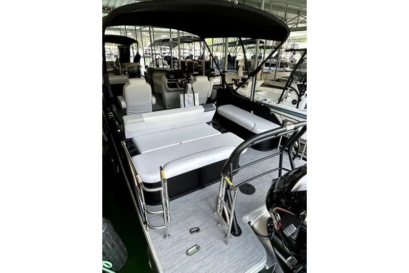 Slide: The Image of 2026 Godfrey Sweetwater 2486 SFLC pontoon boat interior with seating and helm. - 6
